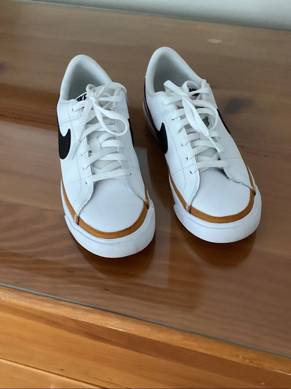 Nike White Leather Sneakers with Black Swoosh and Tan Trim
